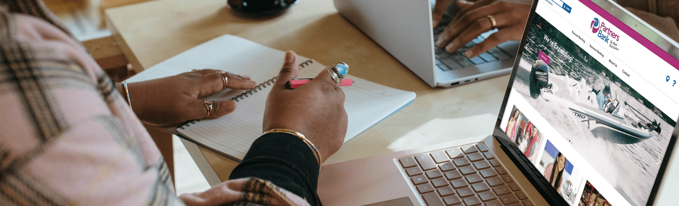 Hands working at a desk