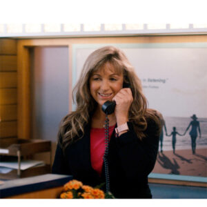 Crystal a Partners Bank employee answering the phone at the Main Office in Sanford Maine