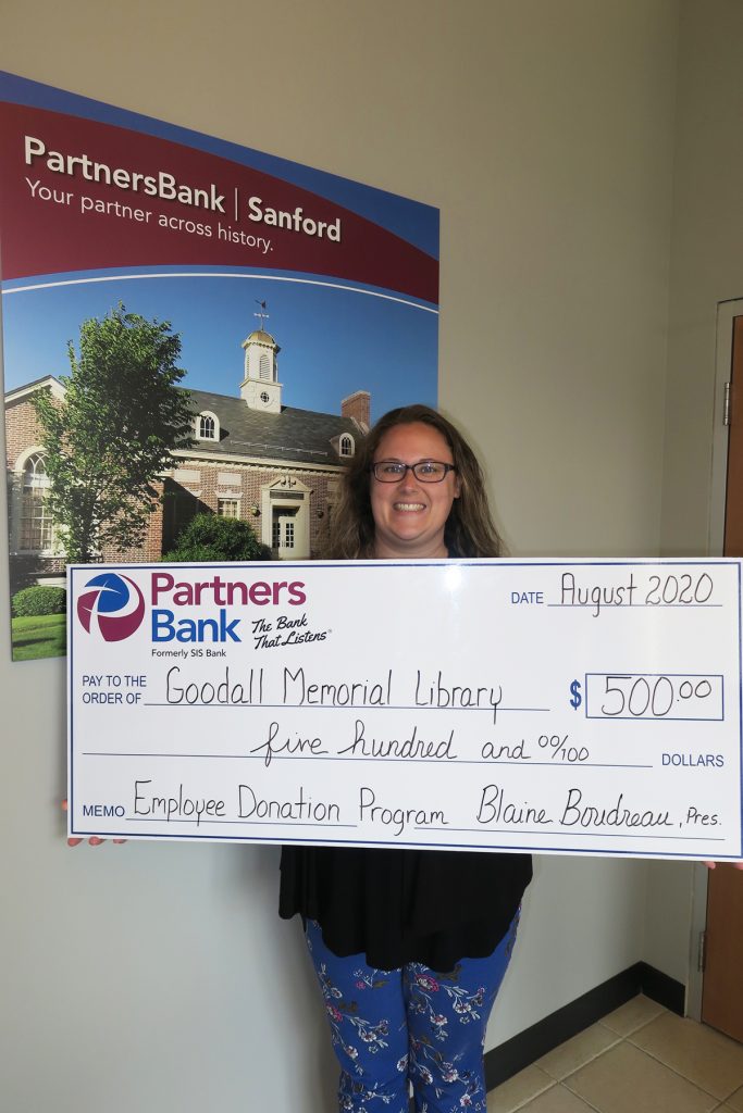 Partners Bank's Libby Gerry with check for $500 to Goodall Memorial Library.