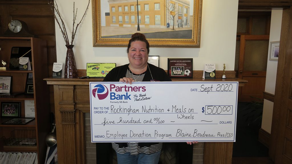 Partners Bank’s SVP/Chief Financial Officer, Jennifer Stauffis poses with a check for $500 to the Rockingham Nutrition Meals on Wheels program after she was selected as September’s recipient for the Banks’ Employee Donation Program.