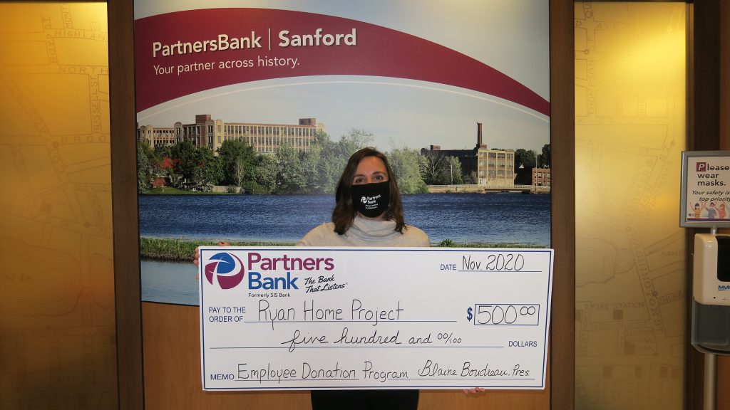 Lisa Holt with check for $500 for Ryan Home Project.