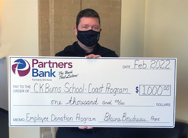 Employee with 1000 dollar check donation