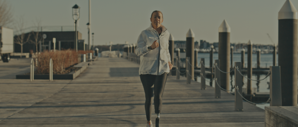 Adrianne Running on walkway